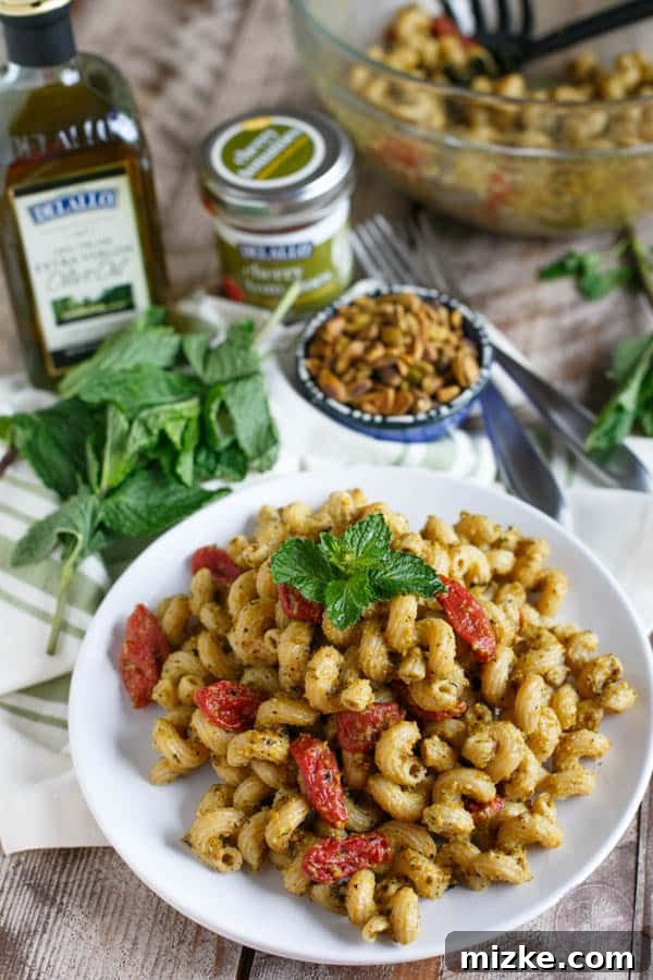 Pistachio mint pesto pasta will make you wonder where it has been all your life and it will be the only pesto you want to make! Less than 30 minutes gets this flavorful pasta dish on your dinner table! #sponsored
