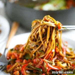 Vibrant Zoodle Cashew Stir Fry 7 This easy zucchini noodle cashew stir fry made with The Inspiralizer will have you licking your plate clean! Dinner comes together in less than 30 minutes and you'll want to put this sauce on every meal! #inspiralizer
