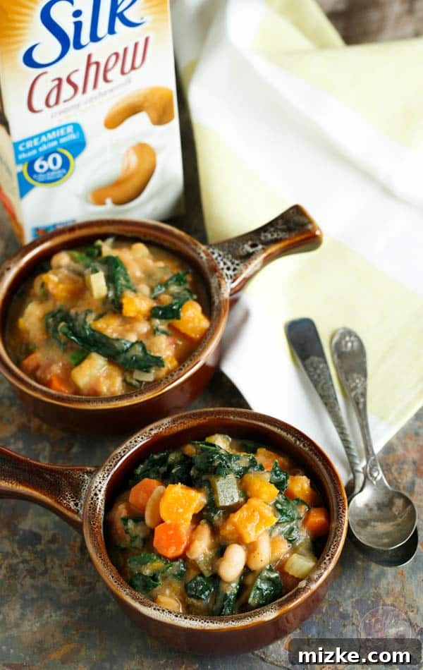 Golden Butternut White Bean Kale Stew 2 Hearty and delicious butternut squash white bean kale stew, perfect for warming up during fall football games. This plant-based recipe is packed with nutritious vegetables and creamy cashew milk!