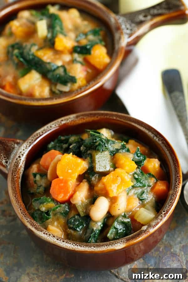 Golden Butternut White Bean Kale Stew 3 A vibrant, dairy-free, and meatless butternut squash white bean kale stew, ideal for satisfying hunger on chilly game nights. Featuring wholesome vegetables and a rich, creamy texture.