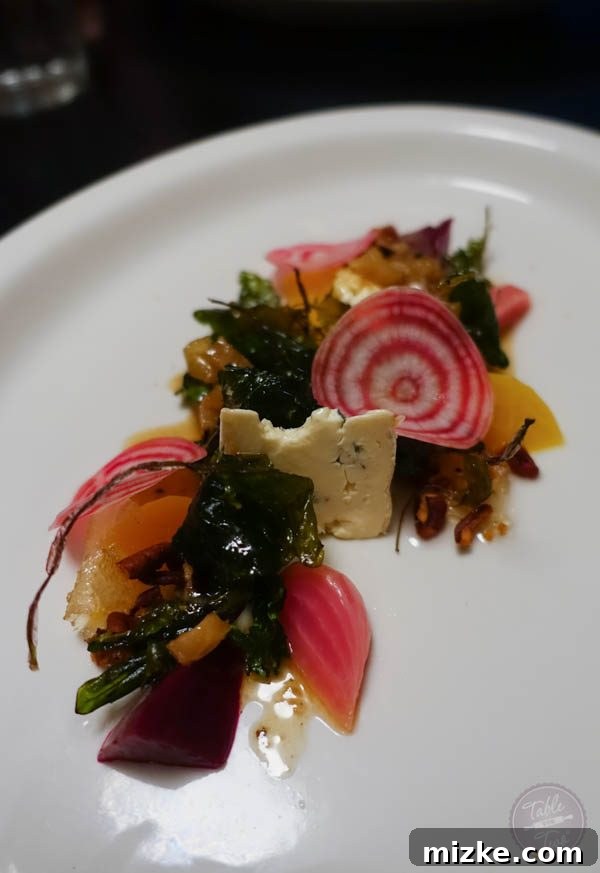 The Enchanting Hudson Valley 35 A vibrant beet appetizer, elegantly plated with cambozola cheese and fresh herbs, a true gourmet delight.