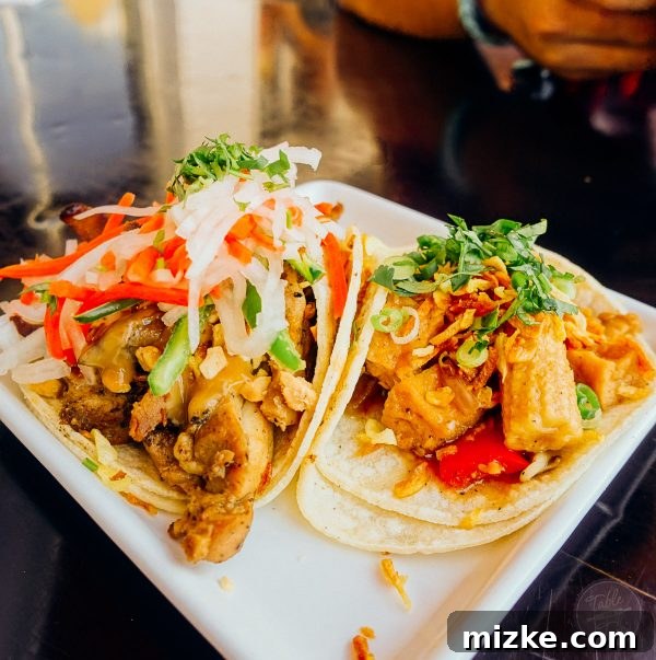 Colorful and flavorful Asian fusion tacos, highlighting Komodo's creative culinary approach.