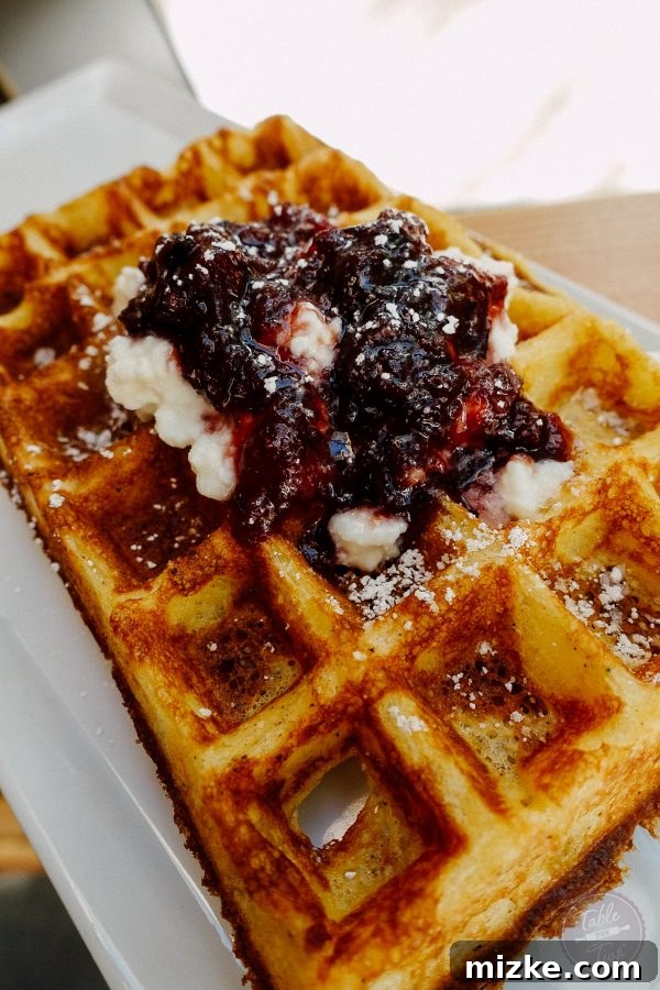 Gourmet coffee and corn flour yeast waffle with homemade jam and ricotta from G&B Coffee.