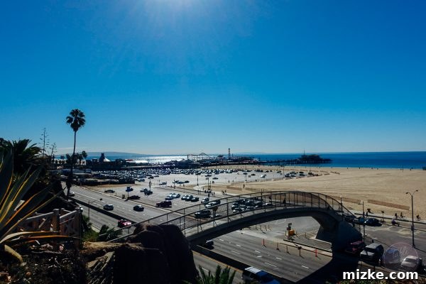 Iconic Santa Monica Pier at sunset, capturing the vibrant atmosphere and Pacific Ocean views.