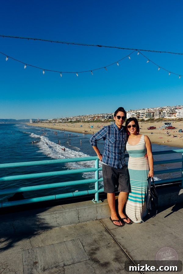 A serene view of waves gently lapping onto Manhattan Beach, perfect for relaxation.