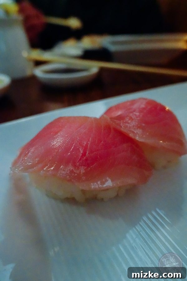 Fresh yellowtail nigiri sushi from SUGARFISH, emphasizing the quality of ingredients.