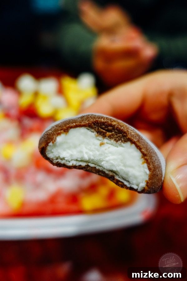 Assortment of homemade mochi ice creams from Aloha Pizza, showcasing chocolate and coconut flavors.