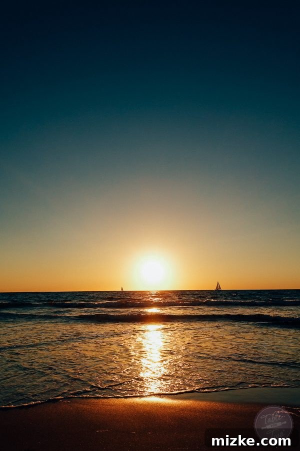 Vibrant colors of an LA sunset reflecting on the ocean, creating a serene and beautiful scene.