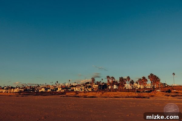 The sun dipping below the horizon, casting a warm glow over the California coast.