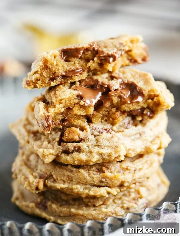 Peanut Butter Obsession Cookies 3 Close-up shot of Peanut Butter Overload Cookies, showcasing their soft texture and generous chunks of Reese's Peanut Butter Cups.