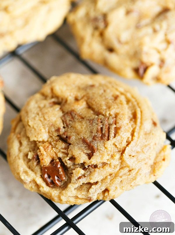 Peanut Butter Obsession Cookies 4 A stack of perfectly baked Peanut Butter Overload Cookies, inviting and ready to be enjoyed.