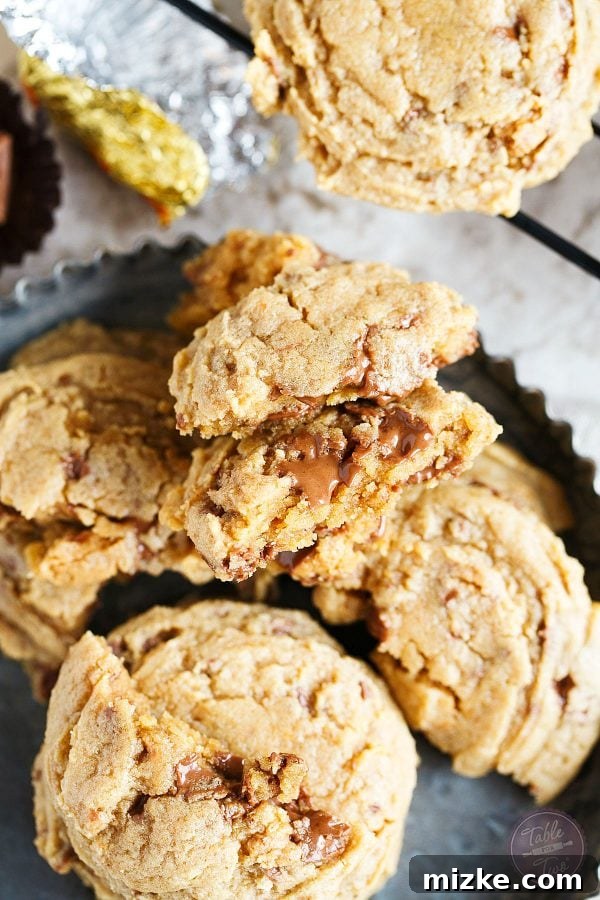 Peanut Butter Obsession Cookies 5 An array of freshly baked Peanut Butter Overload Cookies, beautifully golden-brown and rich.