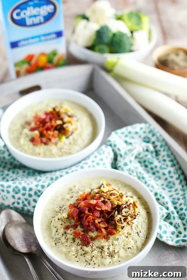 Golden Roasted Broccoli Cauliflower Soup with Savory Bacon Leek Crunch 3 Close-up of creamy broccoli and cauliflower soup, showcasing its smooth texture and rich, inviting color.