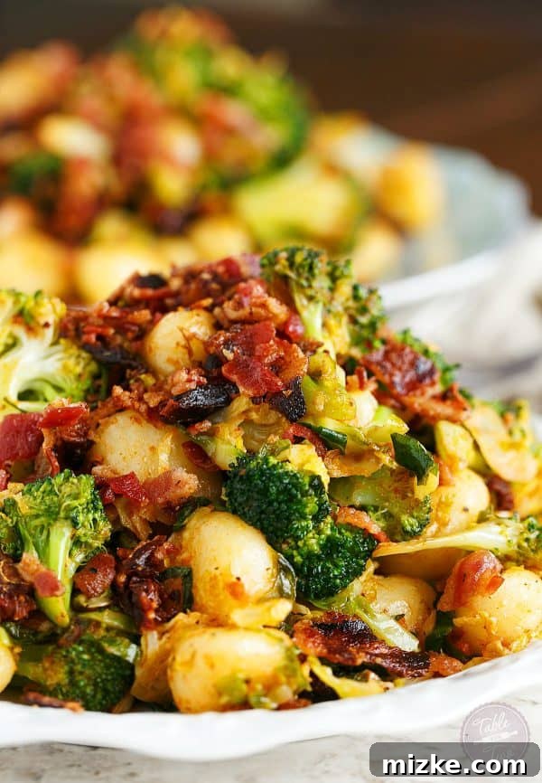 25-Minute Crispy Bacon Gnocchi with Roasted Broccoli & Shaved Brussels 2 A vibrant and appealing dish of bacon gnocchi with tender broccoli and perfectly shaved Brussels sprouts, promising a quick and delicious weeknight dinner.