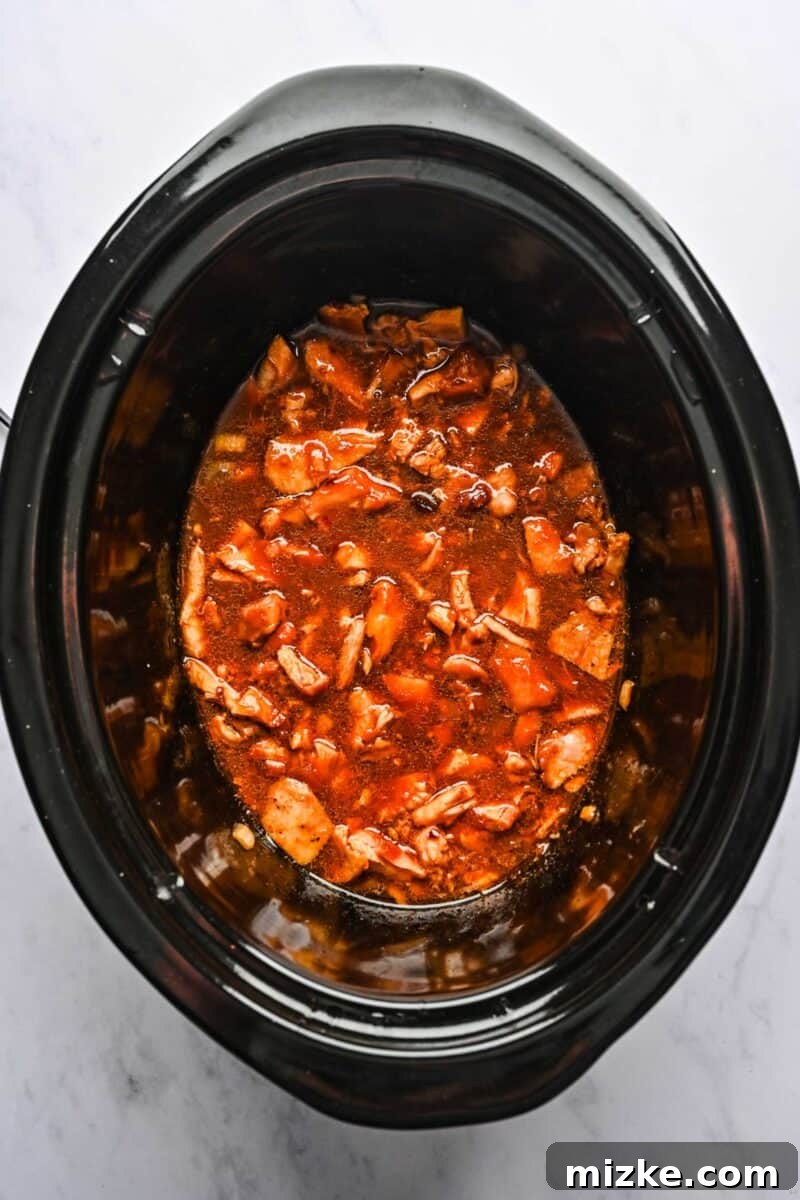 Finished Crockpot Honey Sesame Chicken Ready to Serve The finished honey sesame chicken is ready in the crockpot, with every piece beautifully coated in the rich, glossy sauce.