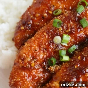 Crispy Sweet and Spicy Chicken Tenders on rice, made with Soy Vay sauce.