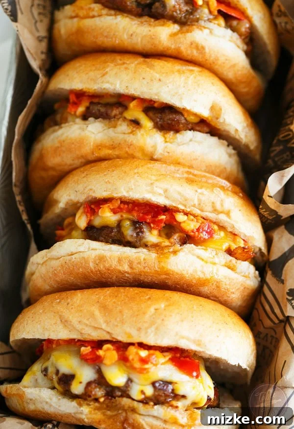 A tantalizing close-up of a homemade Hot Pepper Garlic Chorizo Cheeseburger, loaded with melted cheese and spicy sauce, ready to be devoured.
