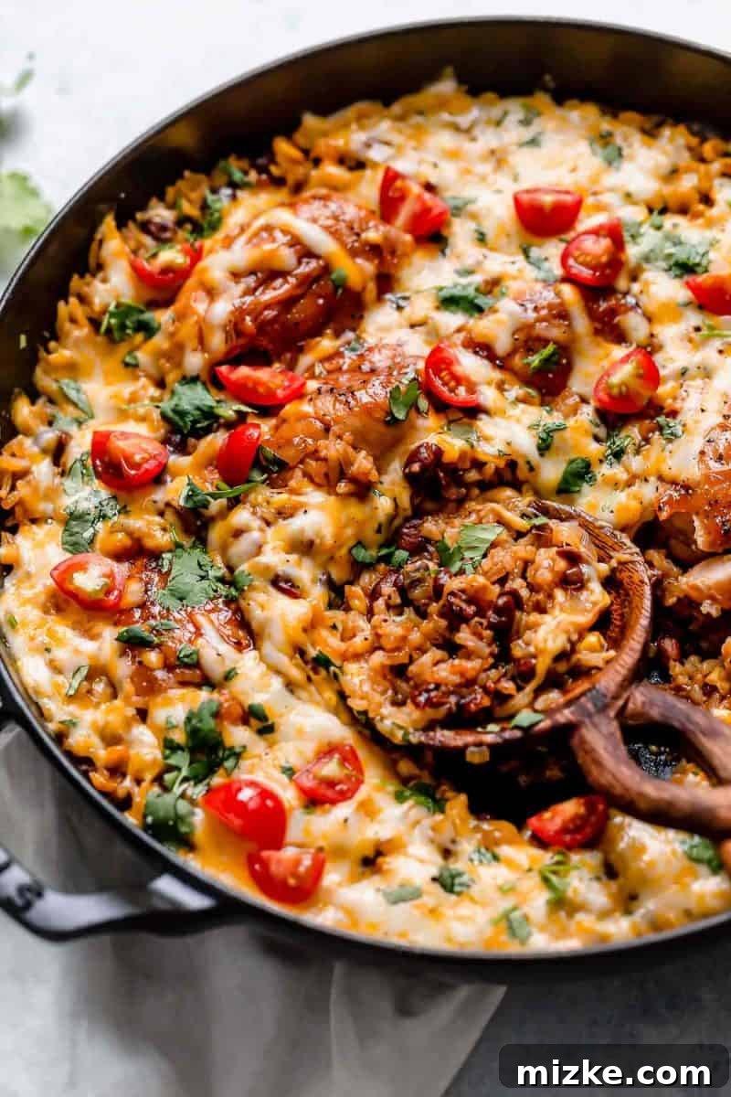 This one-pot BBQ chicken and rice is a weeknight meal saver! It is loaded with flavor and it's basically like having your favorite BBQ restaurant chicken and rice dish at home! Close-up of the delicious one-pot BBQ chicken and rice, showcasing the tender chicken, vibrant corn, and fluffy rice.