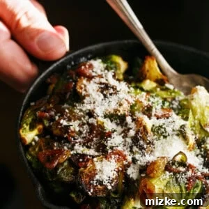 A delectable new side dish featuring roasted brussels sprouts with caramelized shallots and golden raisins, crowned with salty cotija cheese. A must-try!