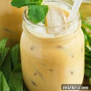The finished Iced Mint Latte, a visually appealing and refreshing beverage that combines coffee and mint beautifully.