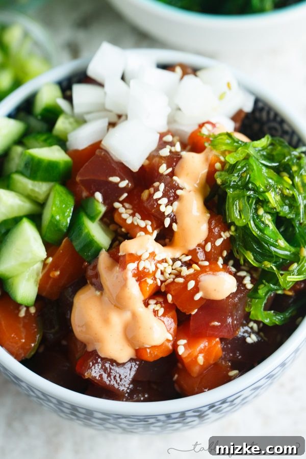 Island Poke Collective 4 Two beautifully arranged homemade poke bowls, showcasing fresh tuna, salmon, and a variety of colorful toppings, ready to be served.