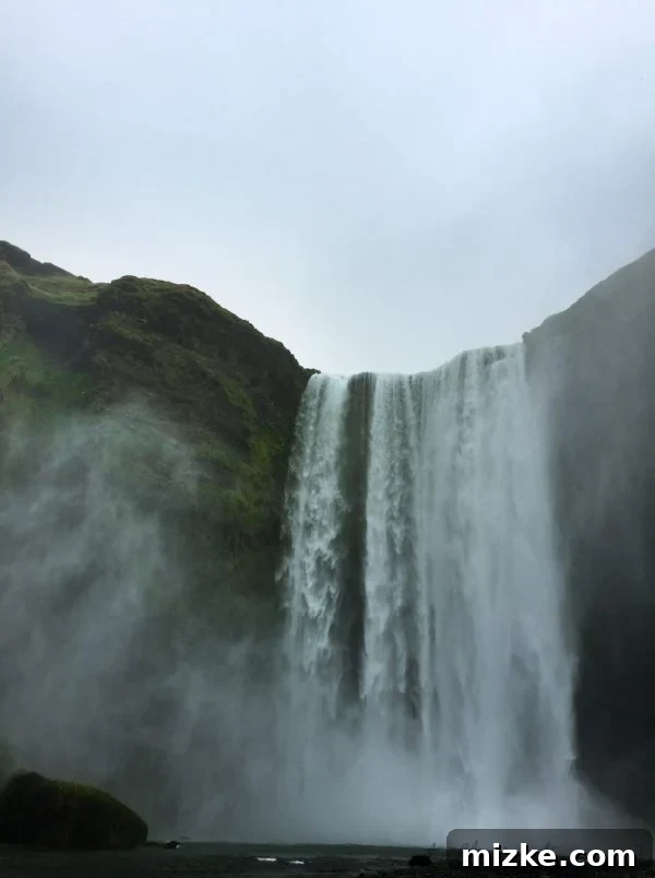 Five Days in Iceland The Vík Experience 4 Close-up view of the majestic Skógafoss waterfall in Iceland, with mist rising from its base