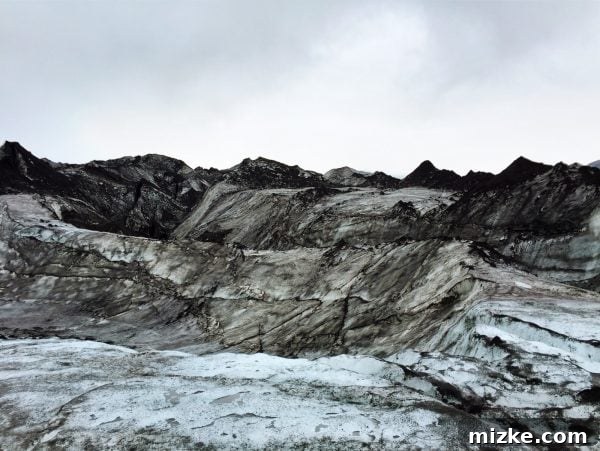 Five Days in Iceland The Vík Experience 5 Participants of a glacier walk on Sólheimajökull, with a guide leading the way on the ice
