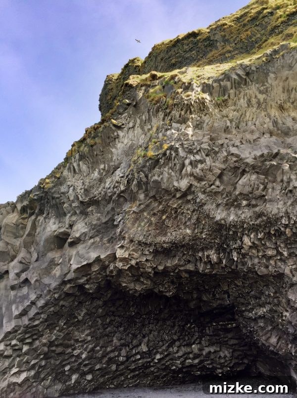 Iceland's Glacial Jewel: A 5-Day Jökulsárlón Exploration 5 Basalt columns rising from the black sand at Reynisfjara