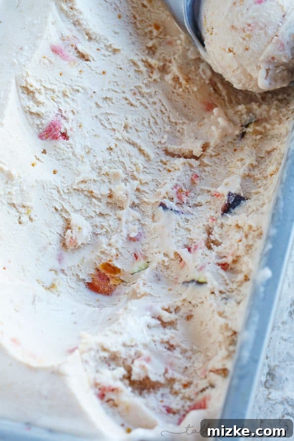 Decadent Fig Honey Mascarpone Ice Cream 2 Luxurious pale pink fig and honey mascarpone ice cream in a bowl, showcasing its rich and creamy texture, a perfect gourmet dessert.