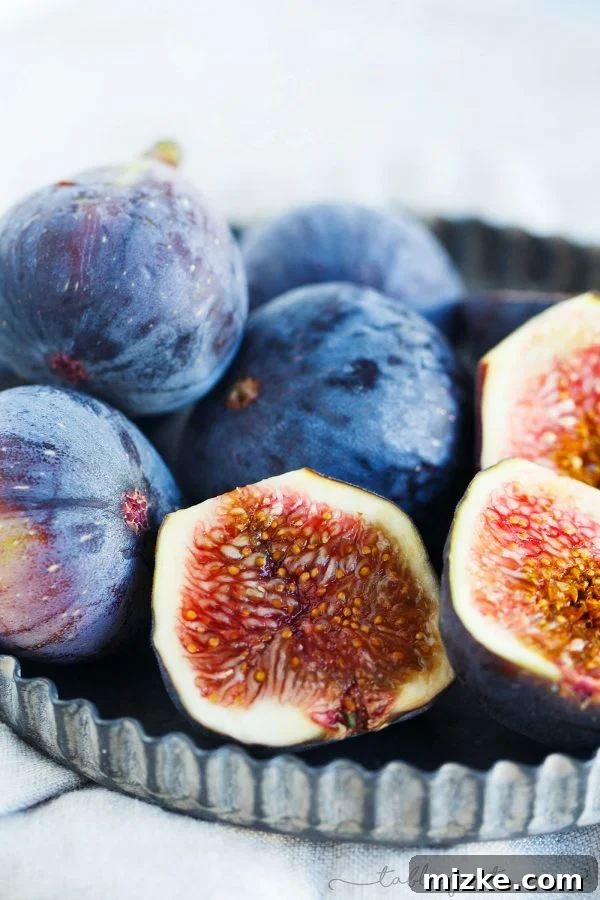 Decadent Fig Honey Mascarpone Ice Cream 4 Fresh, ripe mission figs ready for preparing, demonstrating their beautiful color and plumpness.