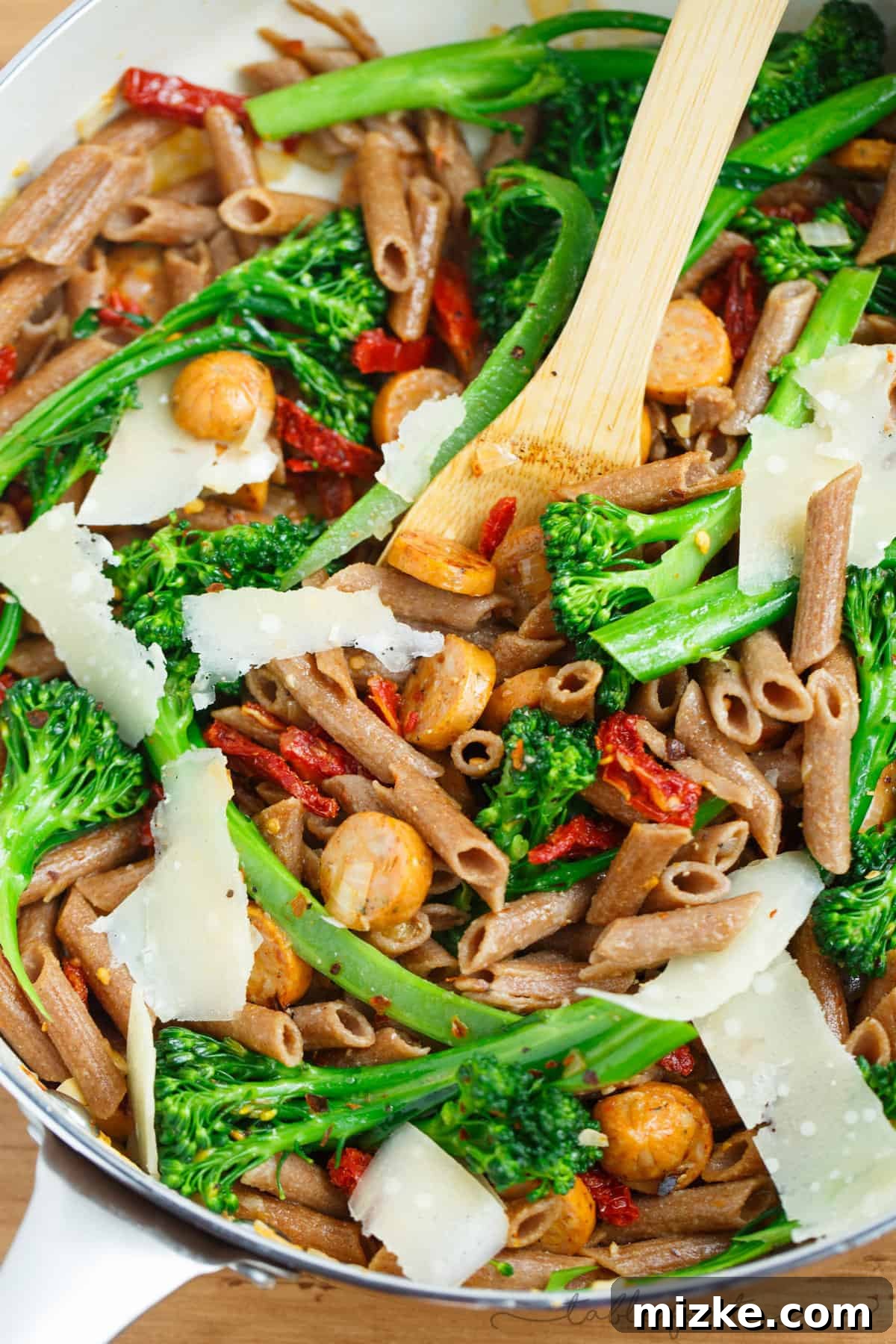 Wholesome Penne with Savory Chicken Sausage, Zesty Sun-Dried Tomatoes, and Bitter Greens 2 A light and hearty pasta dish that will sure to fill you up! This whole wheat penne with broccoli rabe, chicken sausage, and sundried tomatoes is a flavorful and unique pasta dish to put on your dinner table!
