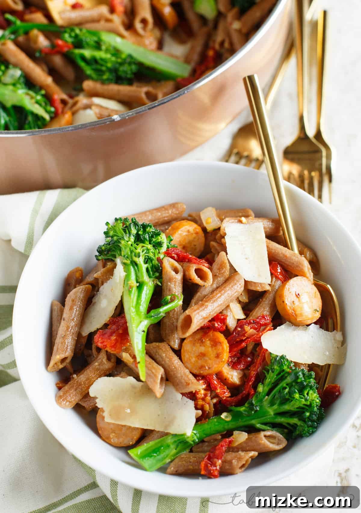 Wholesome Penne with Savory Chicken Sausage, Zesty Sun-Dried Tomatoes, and Bitter Greens 3 A light and hearty pasta dish that will sure to fill you up! This whole wheat penne with broccoli rabe, chicken sausage, and sundried tomatoes is a flavorful and unique pasta dish to put on your dinner table!