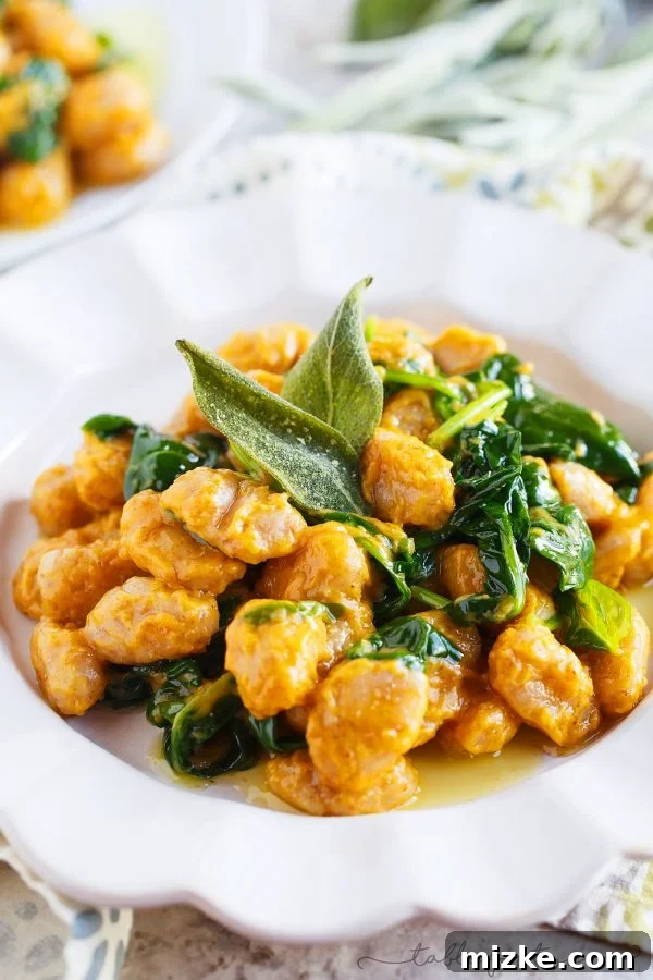 Wholesome Whole Wheat Gnocchi with Brown Butter and Sage Pumpkin Sauce 2 Creamy whole wheat gnocchi with brown butter, sage, and pumpkin sauce, garnished with fresh sage leaves, in a rustic bowl.