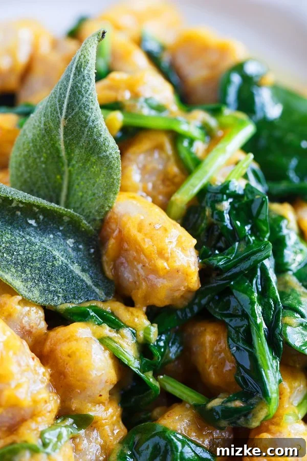 Wholesome Whole Wheat Gnocchi with Brown Butter and Sage Pumpkin Sauce 4 A serving of whole wheat gnocchi with brown butter sage pumpkin sauce in a white bowl, ready to be enjoyed.