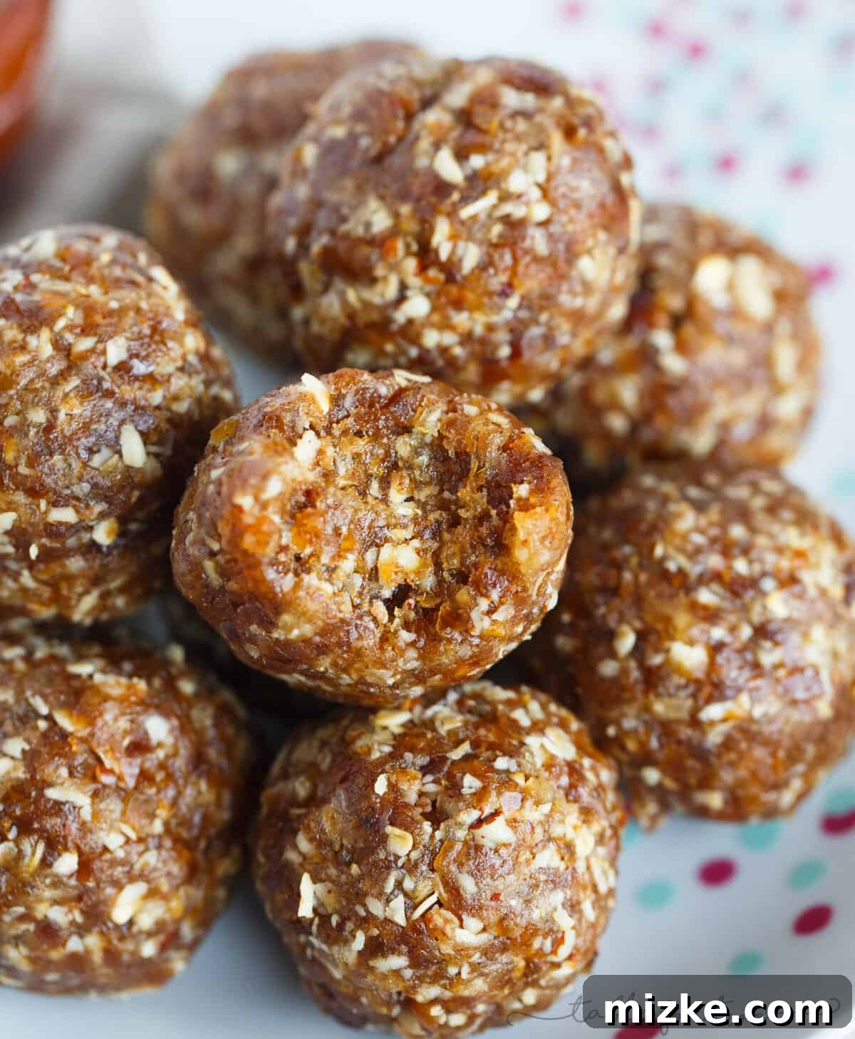 Autumn Glow Energy Bites 3 Close-up of golden-brown pumpkin pie energy snack balls, showcasing their wholesome texture and inviting appearance.