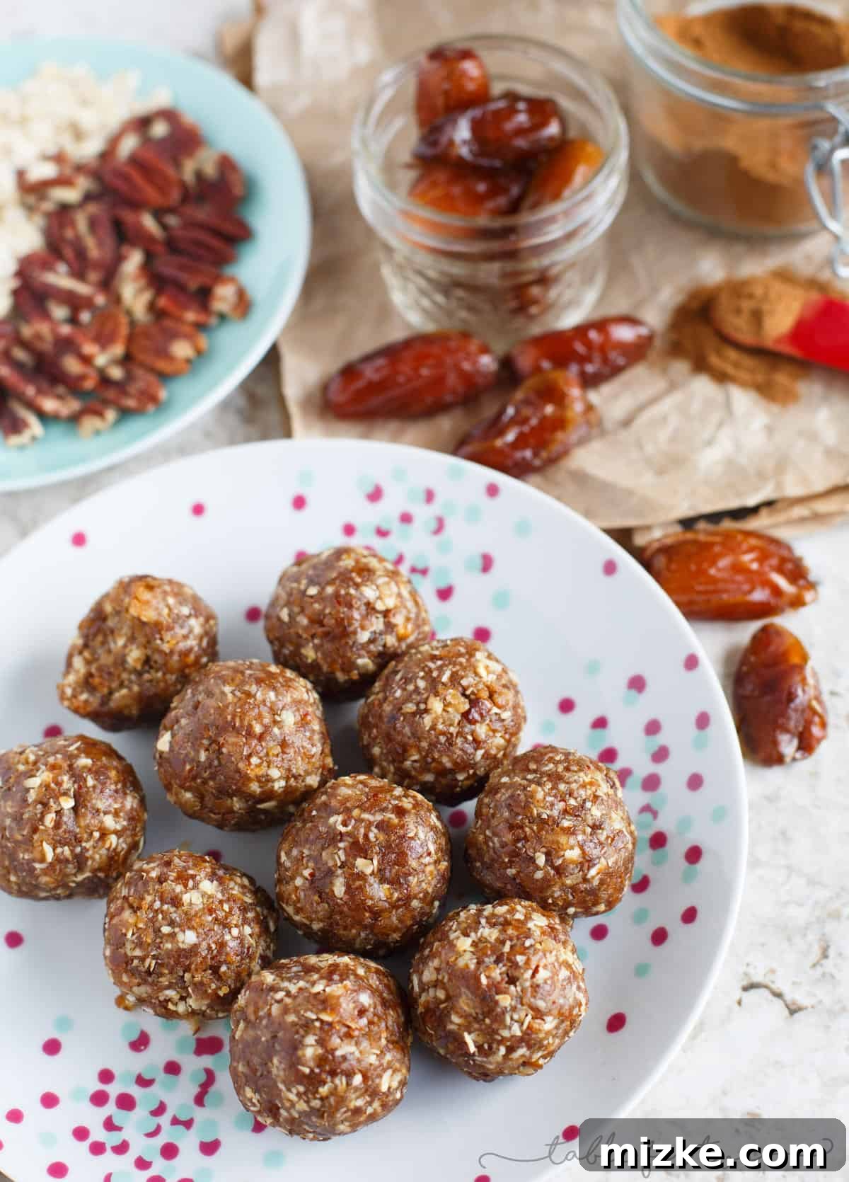 Autumn Glow Energy Bites 4 A trio of perfectly round pumpkin pie energy snack balls, highlighted by soft natural light, emphasizing their health and flavor.