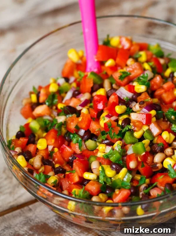 Southwest Fiesta Salad 2 The most colorful salad for your next party or barbecue. Cowboy Caviar is a vibrant mix of fresh vegetables and beans, perfect as a dip or side dish.