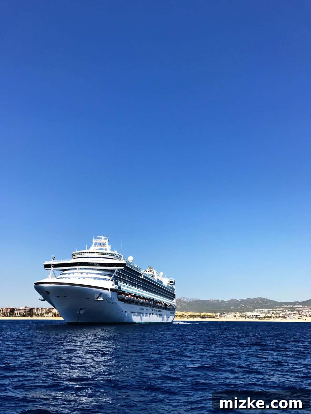 Cabo San Lucas: Mexico's Pacific Gem 4 Friends enjoying a luxurious catamaran cruise past the majestic El Arco at Land's End, Cabo San Lucas, with sparkling blue waters and clear skies.