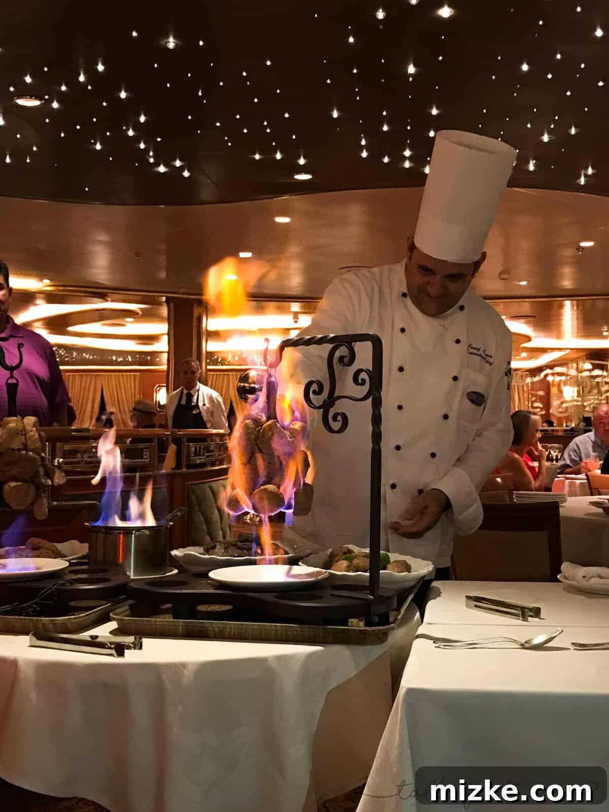 Executive Chef presenting a dish at the exclusive Chef's Table experience on Princess Cruises