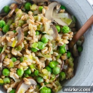 A great way to use farro in this flavorful dish! Filled with leeks, mushrooms, peas, and lots of parmesan cheese; this cozy farro dish is a quick one to whip up anytime of the week!