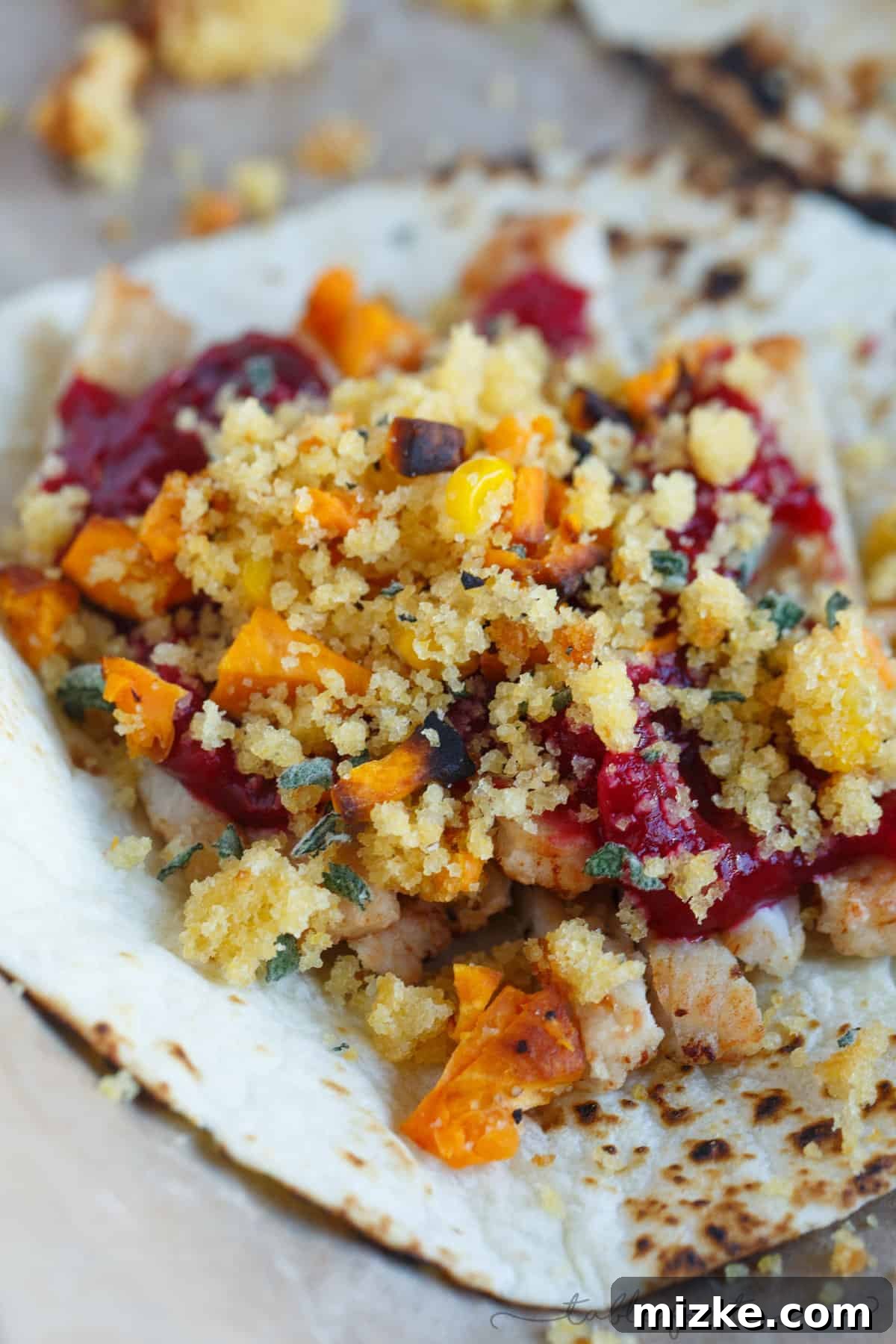 Thanksgiving Taco Twist 4 An array of delicious Thanksgiving ingredients artfully arranged on flour tortillas, ready to be folded into flavorful tacos.