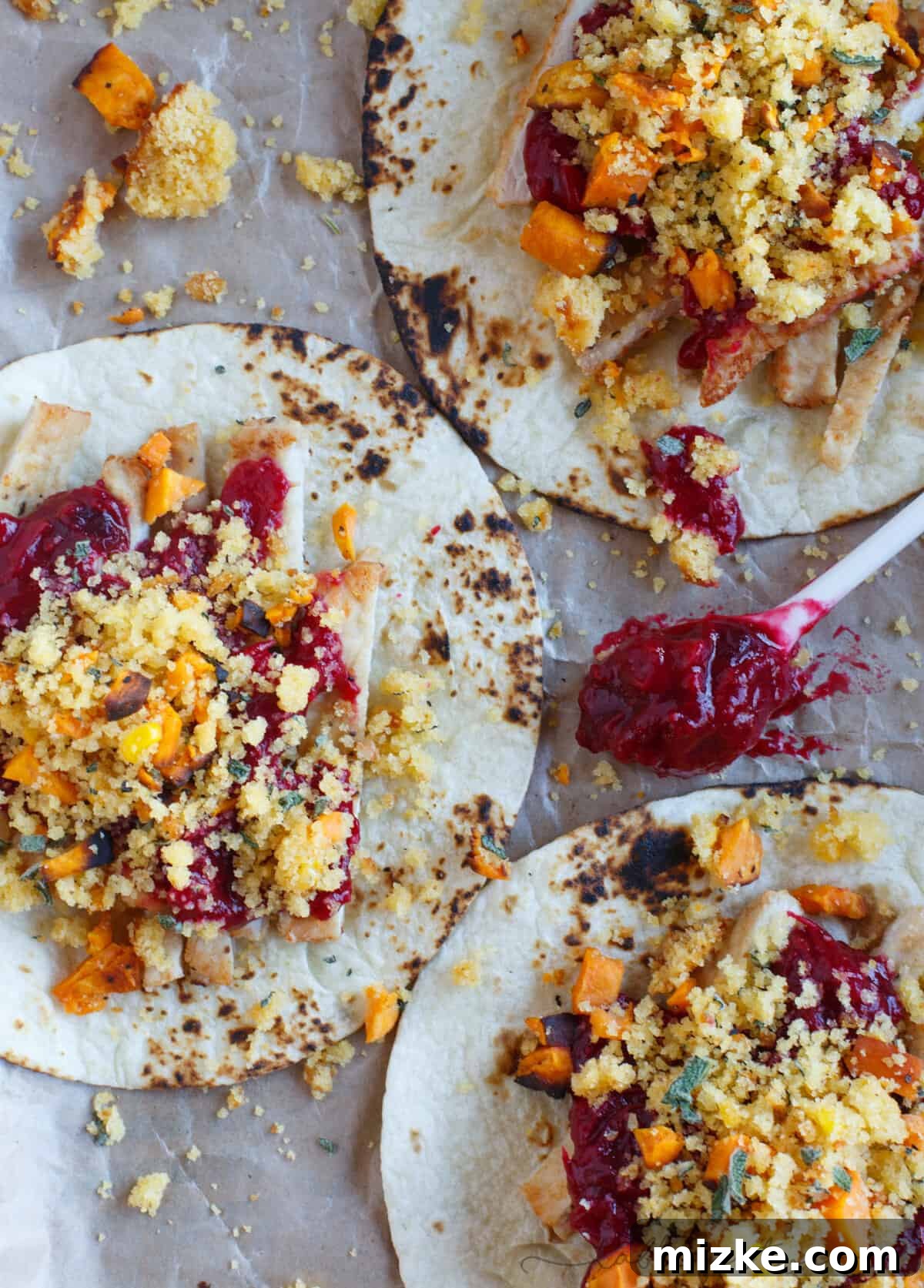 Thanksgiving Taco Twist 5 A close-up shot of two fully loaded Thanksgiving tacos, showcasing the diverse and appealing textures of the repurposed holiday dishes.