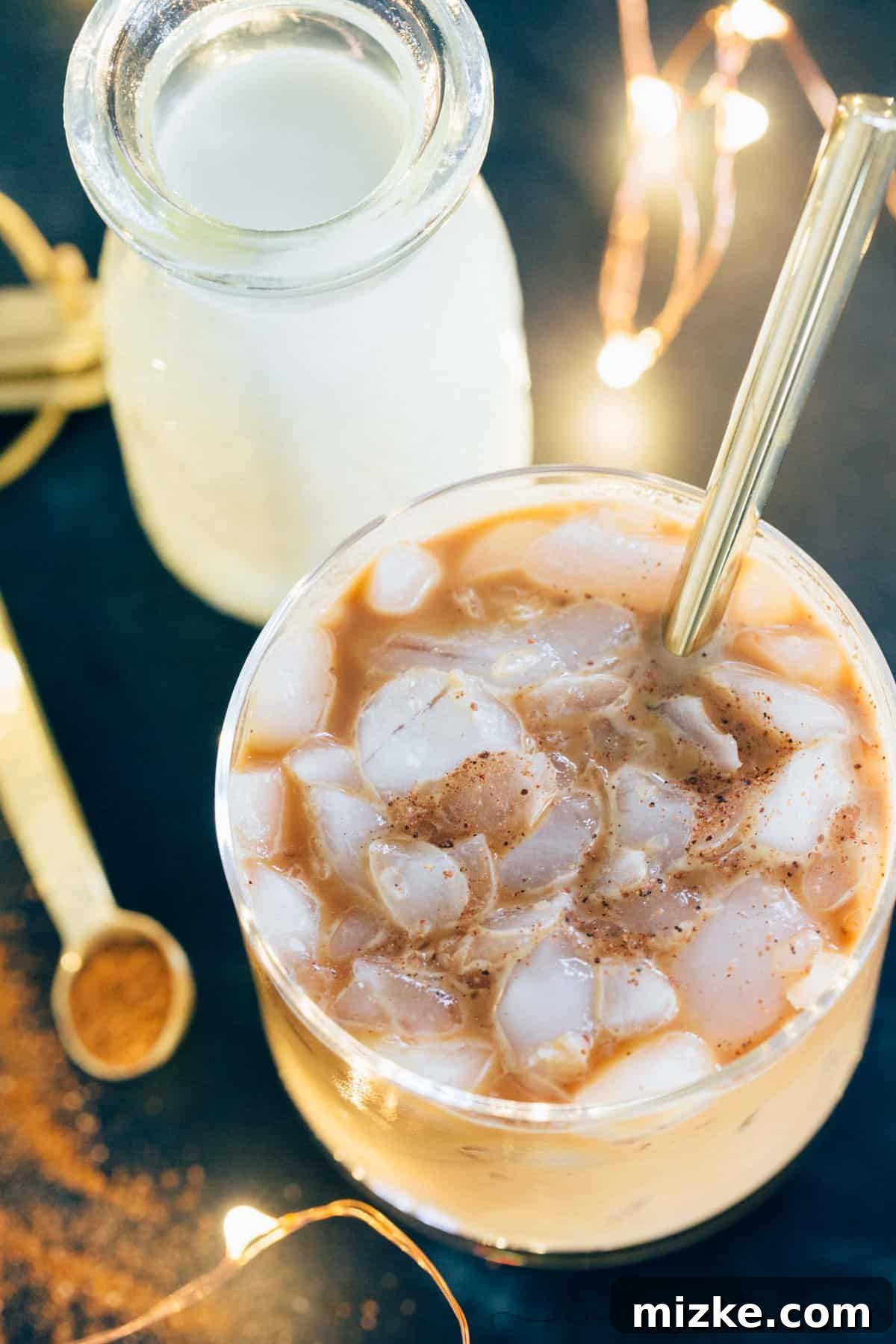Enjoy your festive iced eggnog latte in a cozy setting, perfect for holiday relaxation or a boost of energy.