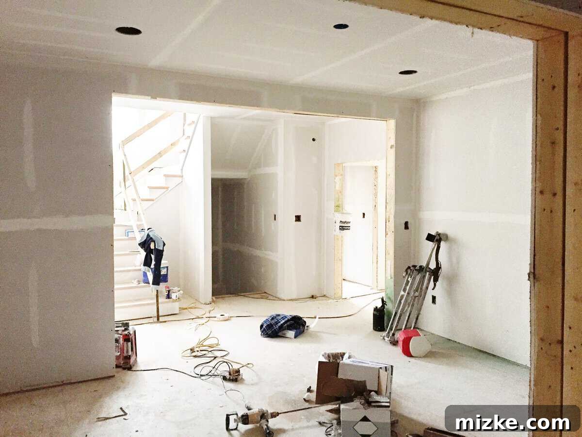 Our Walls Stand Tall 3 Another perspective of newly installed drywall, showcasing smooth interior walls and ceilings, ready for the next stage of home finishing