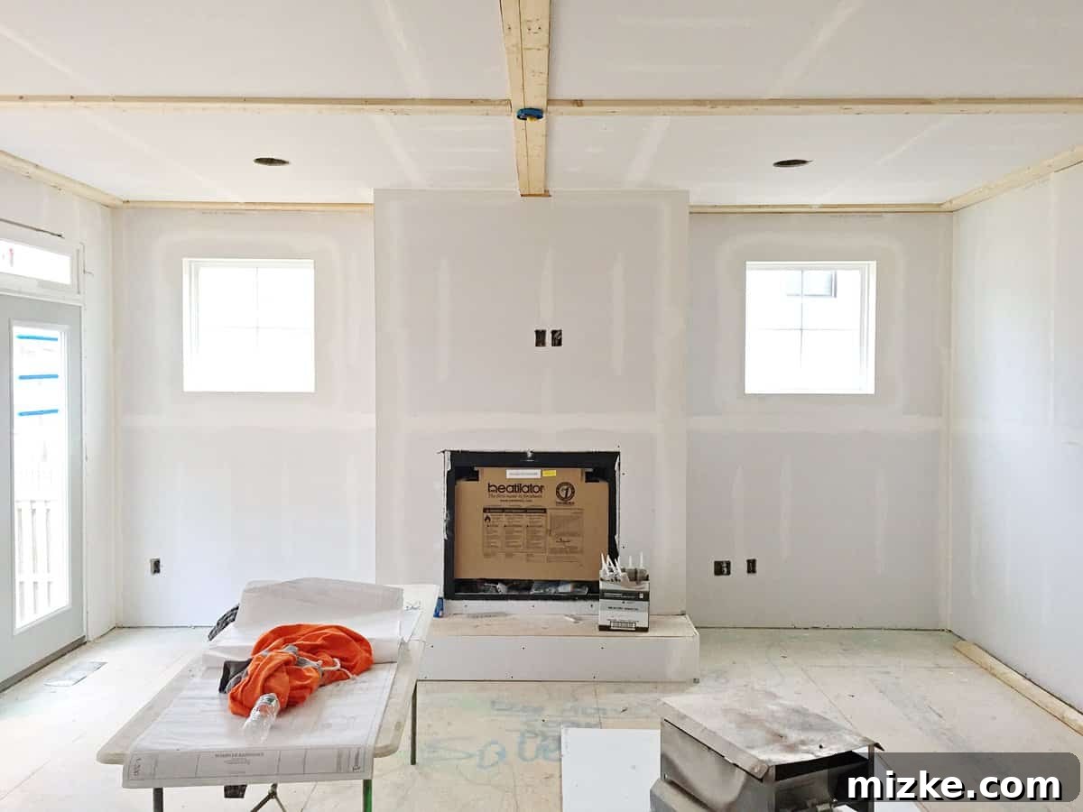 Our Walls Stand Tall 4 Newly painted interior walls in a bright, modern home, illuminated by natural light and awaiting final decorative finishes