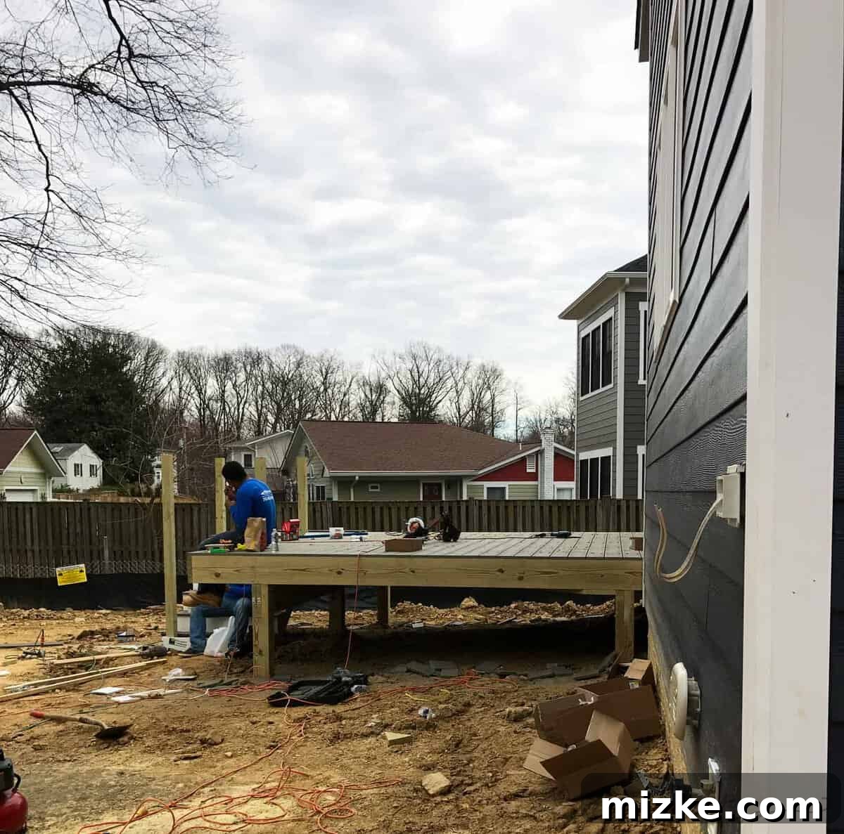 The Final Push 11 Newly constructed outdoor deck attached to a modern custom home, perfect for entertaining.