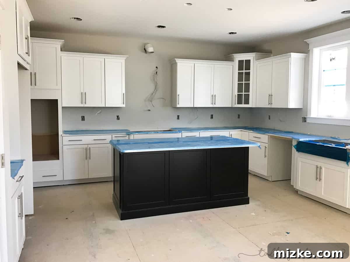 The Final Push 4 Kitchen space nearing completion in a new construction home, highlighting cabinet installation and countertops.