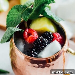 Caribbean Mule 6 A Tropical Moscow Mule cocktail in a copper mug, garnished with pineapple and lime, capturing the essence of a fruity island drink.