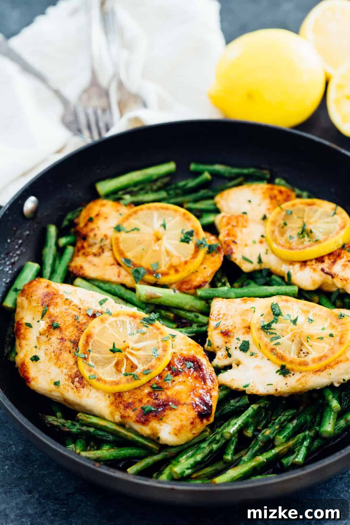 Zesty Honey Butter Chicken with Tender Asparagus 2 Honey Butter Lemon Chicken and Asparagus plated for a delicious weeknight meal.