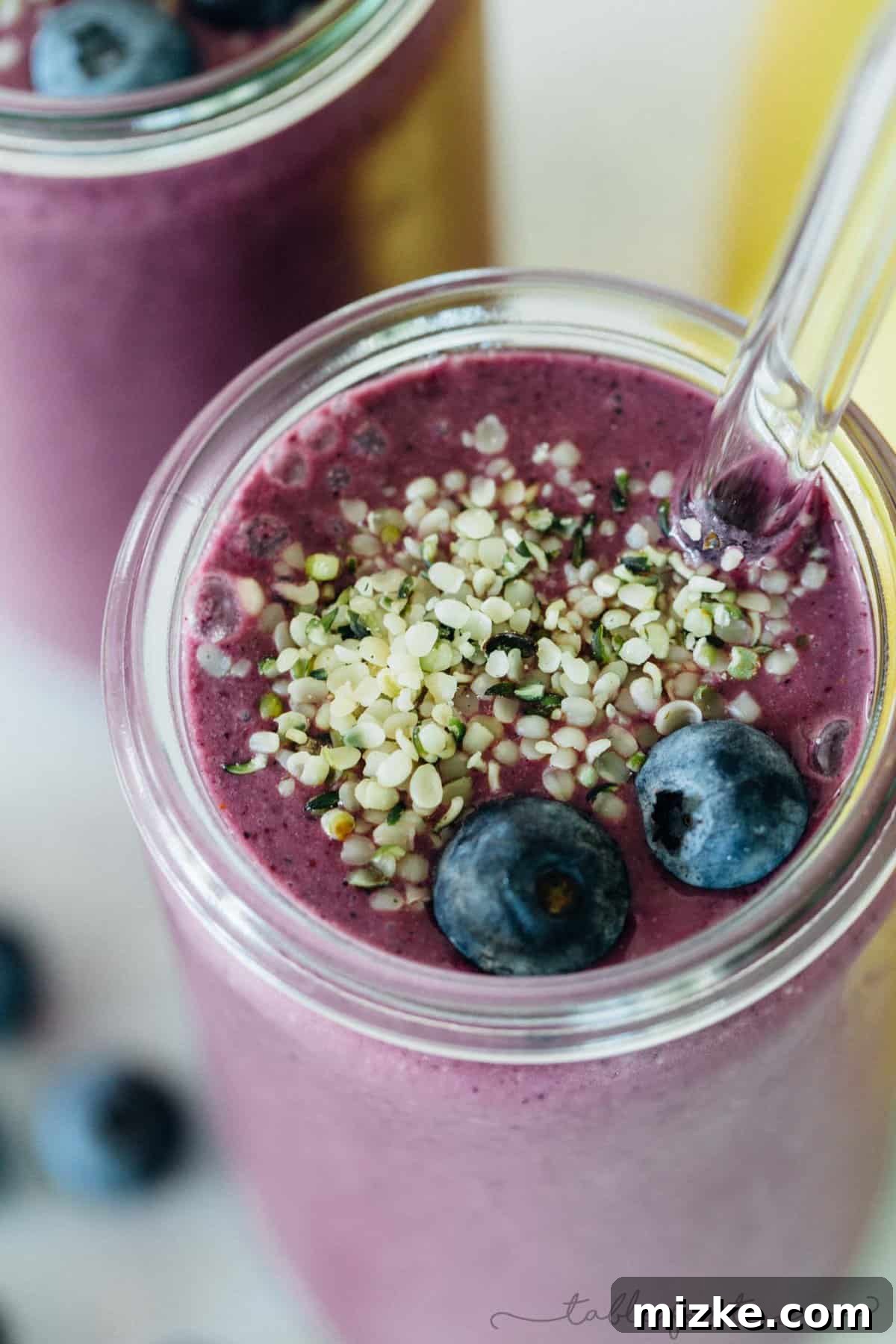 Berry Banana Bliss 2 A deliciously decadent and refreshing blueberry banana smoothie, perfect to kickstart your day or as a post-workout recovery drink. This creamy blend is loaded with antioxidants and vital nutrients.